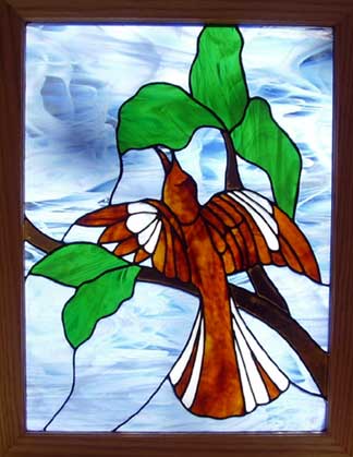 stained glass window of a mockingbird