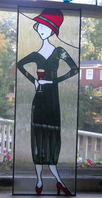 stained glass lady with red hat